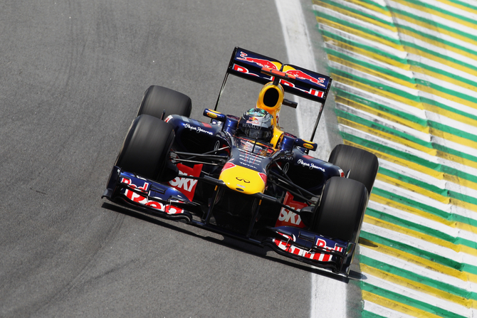 Vettel breaks record with pole in Brazil