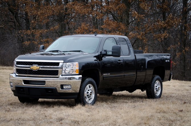 The vehicles include Silverado pickups and Express vans