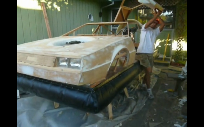 The car has a wooden frame with fiberglass panels