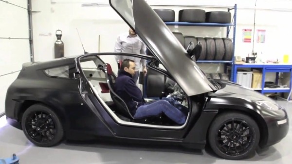 Delta E4 electric coupe goes out for a spin, carrying lucky humanoid