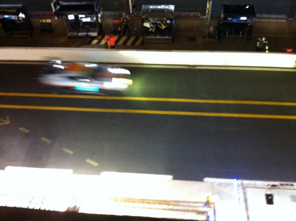 As the night settled over the track, the cars lights zoomed past.