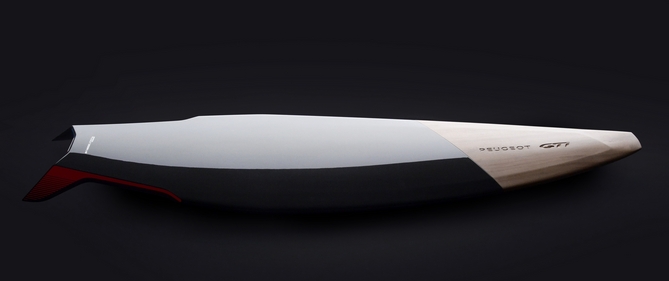 The surfboard is made from carbon fiber and wood