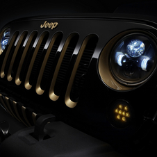 The headlights and grill of the Jeep Wrangler have been accented in gold